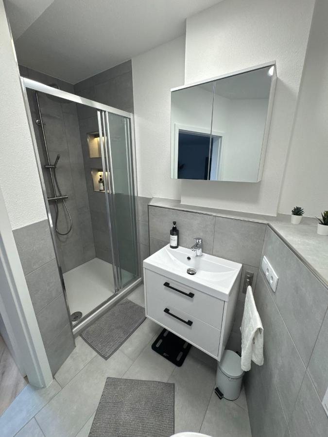 Bathroom with shower and vanity