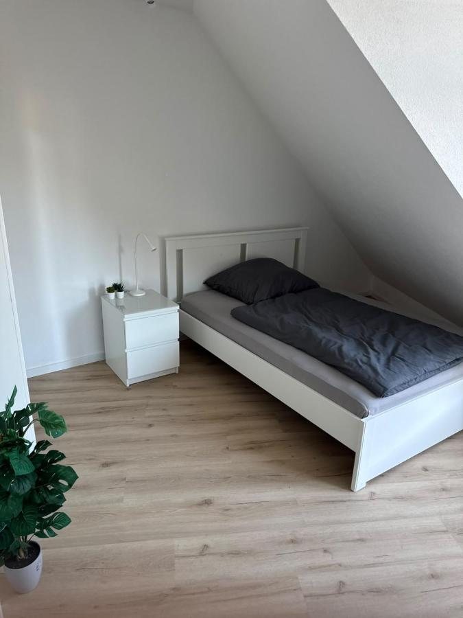 Single bed in a room with sloping ceiling