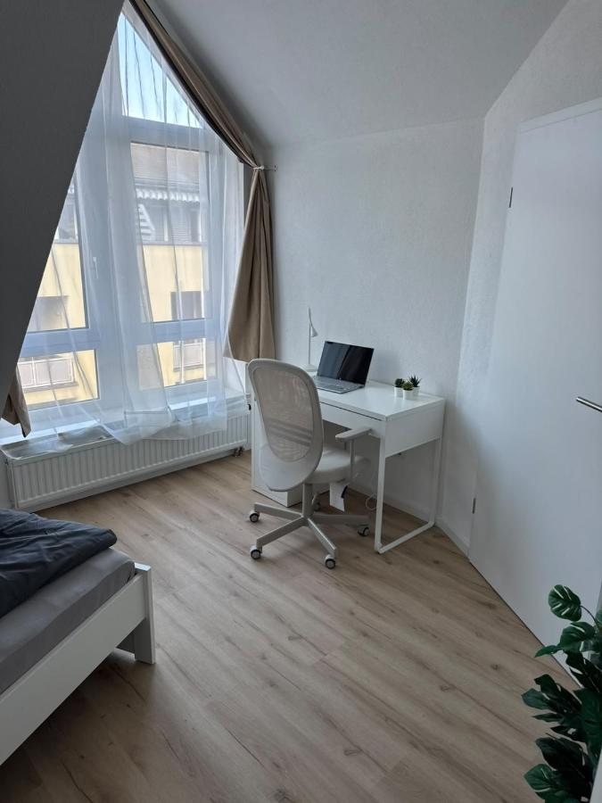 Room with a desk by the large window